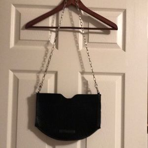 BGBG Maxazria black purse with silver link strap.   Material is silk/cotton.